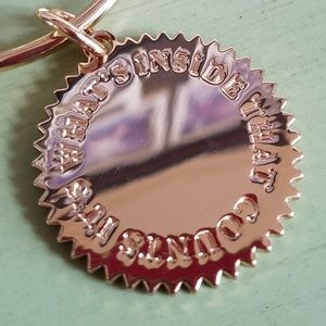 "It's what's inside that counts" charm